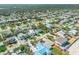 Beautiful aerial view showcasing a coastal neighborhood with lush landscaping and beach access at 4624 Van Kleeck Dr, New Smyrna Beach, FL 32169