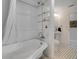 Clean bathroom featuring a claw foot tub with shower and tile floors at 4624 Van Kleeck Dr, New Smyrna Beach, FL 32169