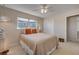 This bedroom has a queen bed with a nice comforter and 2 windows at 4624 Van Kleeck Dr, New Smyrna Beach, FL 32169