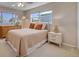 Bright bedroom features a queen bed with light neutral bedding at 4624 Van Kleeck Dr, New Smyrna Beach, FL 32169