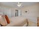 This bedroom has a queen bed with a neutral comforter and white trim at 4624 Van Kleeck Dr, New Smyrna Beach, FL 32169