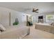 Bright bedroom with two beds and small area for working and reading at 4624 Van Kleeck Dr, New Smyrna Beach, FL 32169