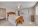 Cozy bedroom boasts a ceiling fan, with an ensuite bath featuring a vintage clawfoot tub at 4624 Van Kleeck Dr, New Smyrna Beach, FL 32169