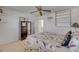 Bedroom with ceiling fan, large window and neutral colors at 4624 Van Kleeck Dr, New Smyrna Beach, FL 32169