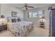 Bedroom with queen size bed, ceiling fan and view of the ocean at 4624 Van Kleeck Dr, New Smyrna Beach, FL 32169