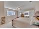 Comfortable bedroom with a bay window, ceiling fan, and neutral decor for a serene retreat at 4624 Van Kleeck Dr, New Smyrna Beach, FL 32169