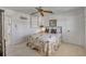 Bedroom with ceiling fan, large window and neutral colors at 4624 Van Kleeck Dr, New Smyrna Beach, FL 32169