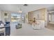 Bright living room features large windows, balcony access, and neutral paint at 4624 Van Kleeck Dr, New Smyrna Beach, FL 32169