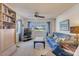 Comfortable living room with blue sofa and view of the outside at 4624 Van Kleeck Dr, New Smyrna Beach, FL 32169