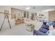 Bright living room with open floorplan, stylish decor, and light wood floors for a relaxing coastal feel at 4624 Van Kleeck Dr, New Smyrna Beach, FL 32169