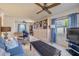 Comfortable living room with a ceiling fan, bookcase and comfortable seating at 4624 Van Kleeck Dr, New Smyrna Beach, FL 32169