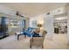 Cozy living room with blue couch and a view of the outside at 4624 Van Kleeck Dr, New Smyrna Beach, FL 32169