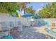 Backyard pool area with spa, patio, umbrellas, lounge chairs and tropical landscaping at 4624 Van Kleeck Dr, New Smyrna Beach, FL 32169