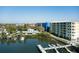 Aerial view of a waterside condo building with a dock along the waterfront at 5 Riverwalk Dr # 506, New Smyrna Beach, FL 32169