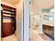 Well designed bathroom with storage, a large soaking tub, walk-in closet, and marble countertops at 5 Riverwalk Dr # 506, New Smyrna Beach, FL 32169