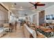 Inviting common area with wicker seating, and an adjacent dining and kitchen area, perfect for gatherings and socializing at 5 Riverwalk Dr # 506, New Smyrna Beach, FL 32169