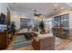 Comfortable common room with wicker seating, a ceiling fan, and ample natural light for residents to relax at 5 Riverwalk Dr # 506, New Smyrna Beach, FL 32169