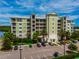 Beautiful condo building with tropical landscaping and ample parking at 5 Riverwalk Dr # 506, New Smyrna Beach, FL 32169