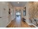 Hallway features tile floors, and leads to a brightly lit dining area, offering a glimpse of inviting interiors at 5 Riverwalk Dr # 506, New Smyrna Beach, FL 32169