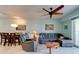Comfortable living room showcasing tile floors, ceiling fan, and relaxing furniture at 5 Riverwalk Dr # 506, New Smyrna Beach, FL 32169