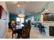 Inviting living space with dining table, sofa and balcony access at 5 Riverwalk Dr # 506, New Smyrna Beach, FL 32169