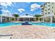 Stunning community pool featuring a large swimming area, several lounge chairs, and a covered seating area at 5 Riverwalk Dr # 506, New Smyrna Beach, FL 32169