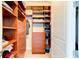Well-organized walk-in closet with built-in shelving and drawers providing ample storage space at 5 Riverwalk Dr # 506, New Smyrna Beach, FL 32169