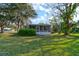 Well-maintained backyard showcasing a screened porch perfect for relaxation and outdoor entertainment at 526 Powers Ave, Port Orange, FL 32127