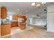 Well-lit kitchen and living area with island, offering a functional and inviting space for cooking and entertaining at 526 Powers Ave, Port Orange, FL 32127