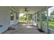Inviting screened porch with outdoor seating, perfect for relaxing and enjoying the view at 526 Powers Ave, Port Orange, FL 32127
