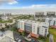 Aerial view showcases the condos, parking and beach views with bright blue skies at 5300 S Atlantic Ave # 3-301, New Smyrna Beach, FL 32169