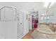 Bathroom with a double sink, walk-in glass shower and large closet at 5300 S Atlantic Ave # 3-301, New Smyrna Beach, FL 32169