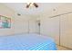 Cozy bedroom with carpeted floors, closet space, and a decorative painting at 5300 S Atlantic Ave # 3-301, New Smyrna Beach, FL 32169