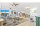 Open-concept living room featuring a comfortable sofa, tile floors, and seamless flow to the kitchen at 5300 S Atlantic Ave # 3-301, New Smyrna Beach, FL 32169
