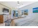 Bright main bedroom with balcony access, coastal decor, and serene view at 5300 S Atlantic Ave # 3-301, New Smyrna Beach, FL 32169
