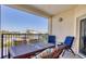 Inviting patio seating with views of blue skies and lush palm trees and greenery at 5300 S Atlantic Ave # 3-301, New Smyrna Beach, FL 32169