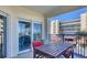 Charming outdoor patio featuring seating and views of the building and surrounding area at 5300 S Atlantic Ave # 3-301, New Smyrna Beach, FL 32169
