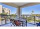 Outdoor patio featuring seating and views of lush greenery, blue skies and other buildings at 5300 S Atlantic Ave # 3-301, New Smyrna Beach, FL 32169