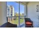 Outdoor balcony providing a serene view of community landscaping and neighboring buildings for a tranquil experience at 5300 S Atlantic Ave # 7-307, New Smyrna Beach, FL 32169