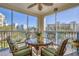 Relaxing screened balcony with wicker furniture, city views and comfortable seating at 5300 S Atlantic Ave # 7-307, New Smyrna Beach, FL 32169