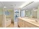 Bright bathroom with a walk-in shower, double sinks, and a soaking tub for a spa-like retreat at 5300 S Atlantic Ave # 7-307, New Smyrna Beach, FL 32169