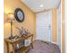 Inviting entryway featuring a decorative table, stylish lamp, and a welcoming atmosphere at 5300 S Atlantic Ave # 7-307, New Smyrna Beach, FL 32169