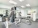 Well-equipped gym with modern weight machines, mirrors, and ample lighting for a complete workout at 5300 S Atlantic Ave # 7-307, New Smyrna Beach, FL 32169