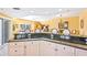 Stylish kitchen with granite countertops, counter seating, and an open layout at 5300 S Atlantic Ave # 7-307, New Smyrna Beach, FL 32169