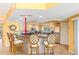 Well-equipped kitchen with tiled bar top, stainless steel appliances, and a functional layout at 5300 S Atlantic Ave # 7-307, New Smyrna Beach, FL 32169