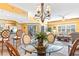 Open concept living and dining area with a view into the kitchen, featuring neutral tones and a modern design at 5300 S Atlantic Ave # 7-307, New Smyrna Beach, FL 32169