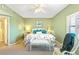 Cozy main bedroom features an accent wall, a ceiling fan, and plantation shutters for optimal light control at 5300 S Atlantic Ave # 7-307, New Smyrna Beach, FL 32169