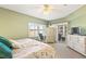Airy main bedroom boasts plenty of natural light, balcony access, and a full-sized dresser at 5300 S Atlantic Ave # 7-307, New Smyrna Beach, FL 32169