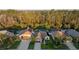 Stunning aerial view of homes surrounded by lush trees, showcasing the neighborhood's charm at 5424 Frederick Lake Dr, Port Orange, FL 32128