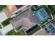 Overhead shot of the home's roof, solar panels, and a screened-in pool at 5424 Frederick Lake Dr, Port Orange, FL 32128